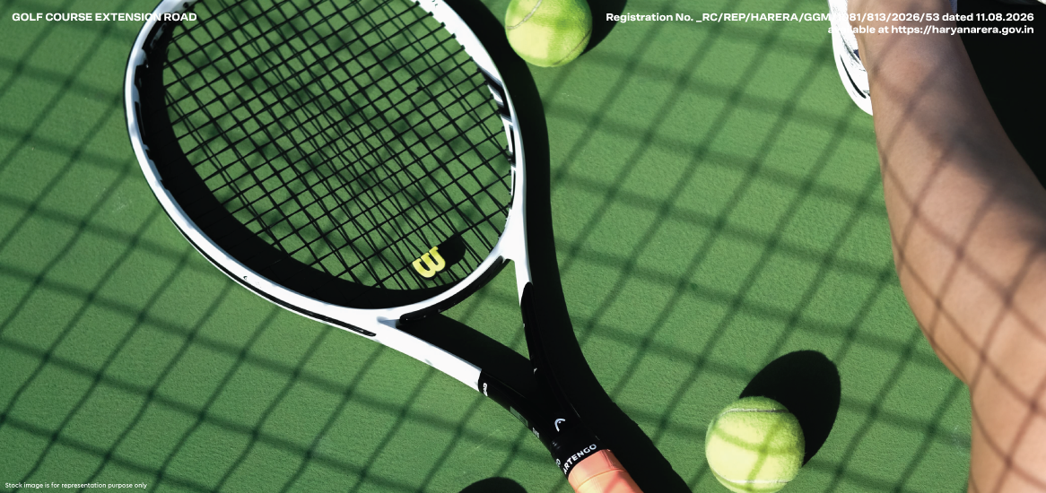 Tennis racquet on a green court, illustrating the Racquet Club at Godrej Verano