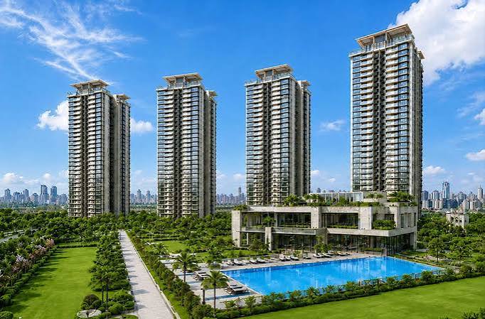 Artist's impression: residential towers with lawn and pool in daylight (illustrative)