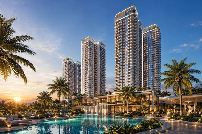 Artist's impression: residential towers beside a pool at sunset (illustrative)